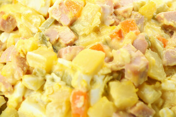 Olivier salad all over background, close up