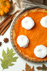 Concept of tasty food with pumpkin pie on white background