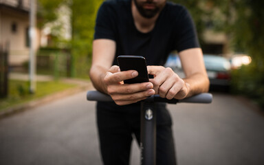 Close up of man hands holding a smart phone on the street