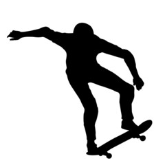 Black silhouette of an athlete skateboarder in a jump