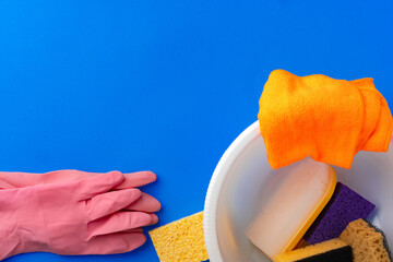 House cleaning supplies on blue color background