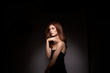 woman model black dress posing studio fashion hairstyle close-up