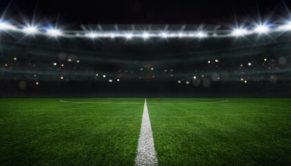 Fototapeta textured free soccer field in the evening light - center, midfield obraz