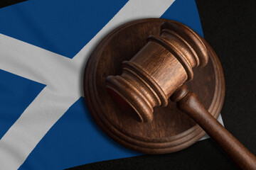 Judge Gavel and flag of Scotland. Law and justice in Scotland. Violation of rights and freedoms