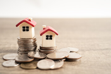 House on stack coins, mortgage home loan finance concept.