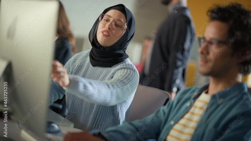 Aufkleber Female Muslim Student Wearing Hijab, Studying in Modern University with Diverse Multiethnic Classmates. She Asks Scholar a Question in College Room. Learning Software Engineering or Computer Science.