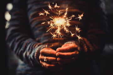 New year holiday celebration christmas and birthday concept with closeup of woman hands holding...
