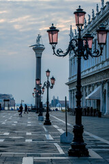 Fototapeta na wymiar Street lamps in San Marco Square in Venice at sunrise