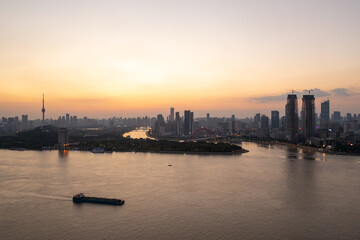 Wuhan skyline and Yangtze river with supertall skyscraper under construction in Wuhan Hubei China.	