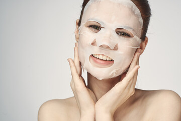 woman in cosmetic mask facial skin care rejuvenation