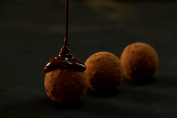 Cooking chocolate truffles, premium creamy chocolate falling from above