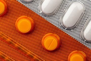 Obraz na płótnie Canvas Close up of pills in blisters. Photo taken under artificial light