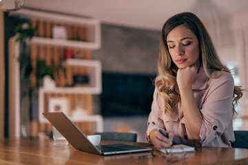 Young woman, writing down everything she hears