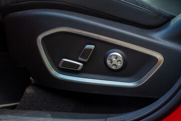Obraz na płótnie Canvas Electric car seat adjustment control panel close up view. Adjustable car seat position. Car interior.