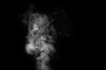 Fragment of white hot curly steam smoke isolated on a black background. Create mystical Halloween photos.