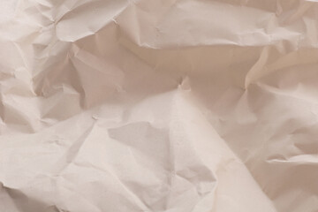 Dark beige crumpled paper with soft texture background