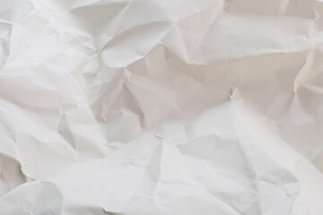 White or light gray crumpled paper with soft texture background