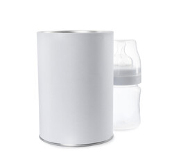 Blank can of powdered infant formula with feeding bottle isolated on white, mockup for design. Baby milk
