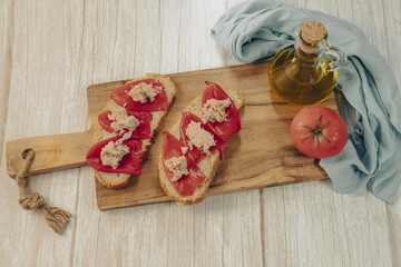 Spanish tapa of escalibada with peppers and tuna.