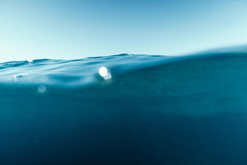 Split View Half Over and Under Ocean Surface whit Clear Sky. Background Concept © nicolas