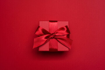 Christmas, Valentine Day or Anniversary red gift box decorated with red satin bow