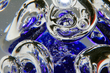 Vibrant Abstract Glass Swirls and Bubbles from a Paperweight with Lines and Colours