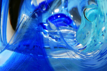 Fototapeta na wymiar Vibrant Abstract Glass Swirls and Bubbles from a Paperweight with Lines and Colours