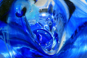 Vibrant Abstract Glass Swirls and Bubbles from a Paperweight with Lines and Colours