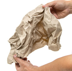 crumpled wad of paper in hand on white background