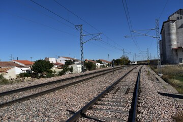 Fototapeta na wymiar Train tracks through a small town called Gomecello in Salamanca