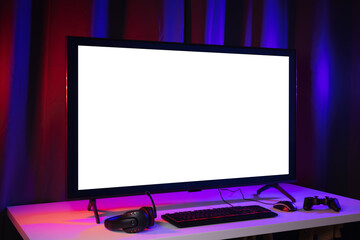 Blank screen display computer pc with gaming gear joystick mouse keyboard mouse. Gamer gadget background in game station.