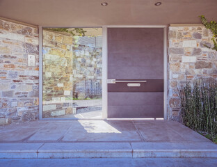 contemporary house front entrance stone, glass and metal door, Athens Greece