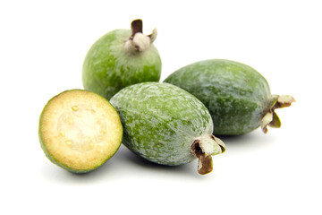 Feijoa fruit or whole and half pineapple guava isolated on white