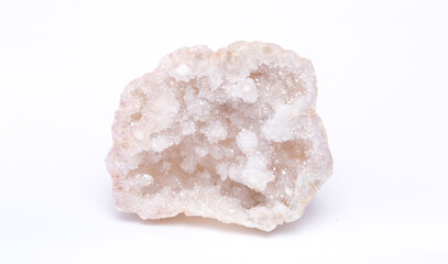 Argonium white crystals. Gems. Mineral crystals in the natural environment. Stone of precious crystals on white background is insulated. Copy space. Colored shiny surface gemstones.