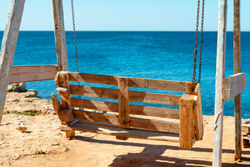 Wooden swing on the Black Sea coast in Crimea.
