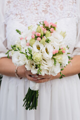 bride holding a beautiful wedding bouquet