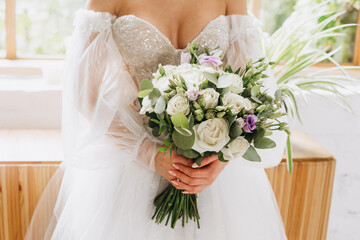 bride holding a beautiful wedding bouquet