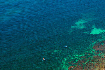 Top view of the amazing azure sea water with yachts, minimalist natural landscape