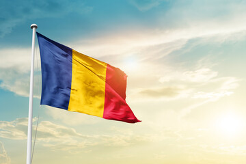 Chad national flag cloth fabric waving on the sky - Image