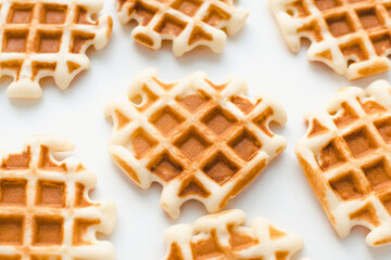 Homemade waffles on a white plate. Soft waffles. 