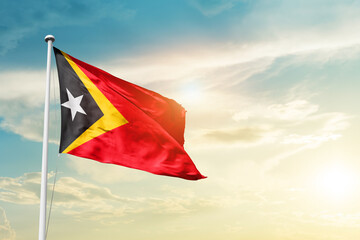 East Timor national flag cloth fabric waving on the sky - Image
