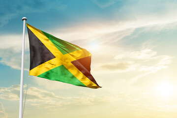 Jamaica national flag cloth fabric waving on the sky - Image - obrazy, fototapety, plakaty