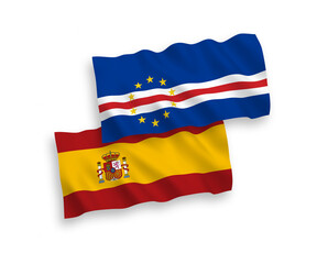 National vector fabric wave flags of Republic of Cabo Verde and Spain isolated on white background. 1 to 2 proportion.