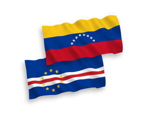 National vector fabric wave flags of Venezuela and Republic of Cabo Verde isolated on white background. 1 to 2 proportion.