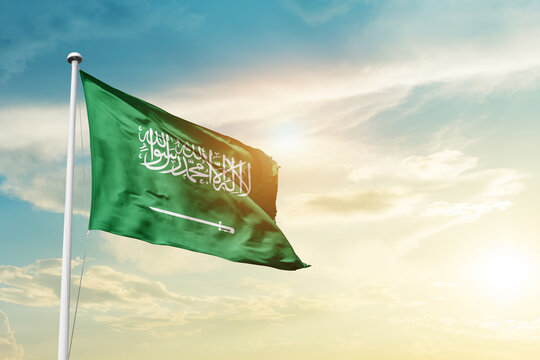 Saudi Arabia national flag cloth fabric waving on the sky - Image