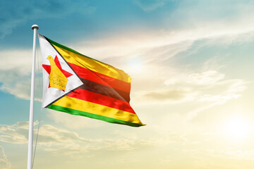 Zimbabwe national flag cloth fabric waving on the sky - Image