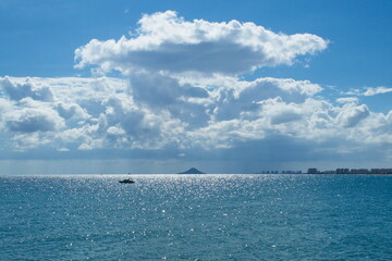 Nice seascape with boats going through the surf in vacation time