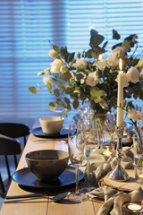 Festive table setting with beautiful tableware and decor indoors