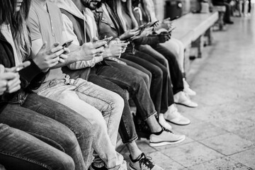 Young happy people using mobile phones outdoor - Technology addiction concept