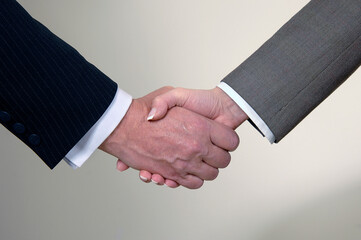 hands in a gesture of greeting against a white background